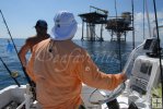 Slow-trolling an oil rig