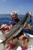 Young angler and cobia