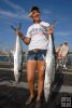 Pier gal with kingfish