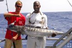 Happy anglers with wahoo