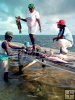 Belizeans cleaning fish
