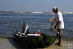 Jonboat pulled onto an ocean beach