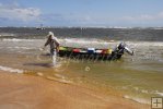 Wading ashore from jonboat