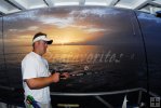 Calm sunrise; Gulf partyboat angler waits for a bite