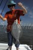 Female angler with flounder