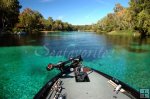 Bassboat easing upriver