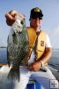 Angler with big black crappie