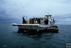 Purse seiner with strike boat