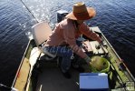 Preparing gear in jonboat